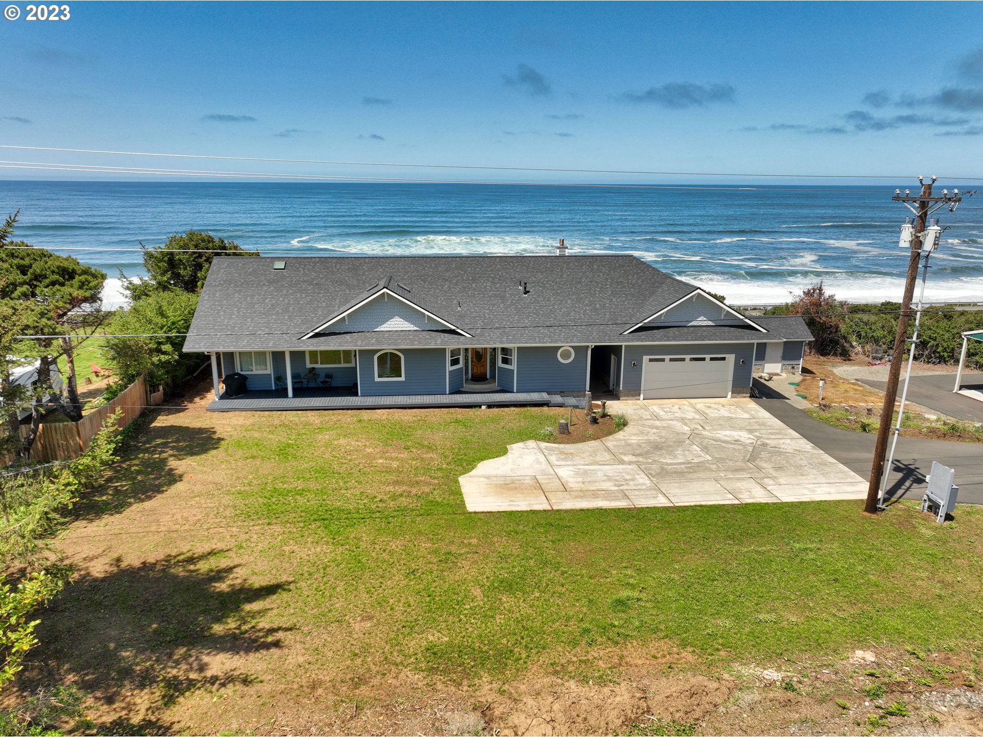 33704 Ophir Road Gold Beach, OR 97444 - Photo 41 of 47 a front view of a house with a yard