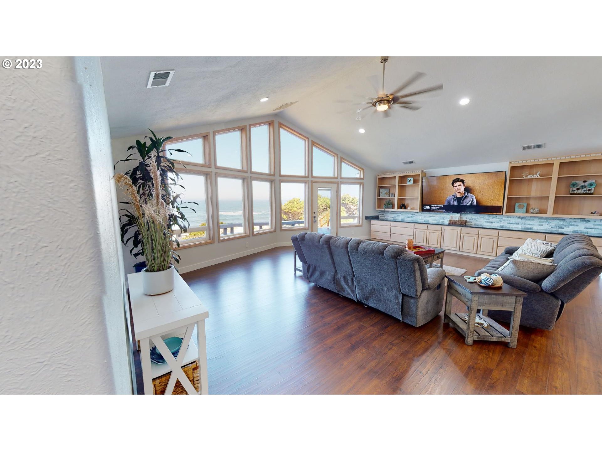 33704 Ophir Road Gold Beach, OR 97444 - Photo 6 of 47 a living room with furniture and a wooden floor