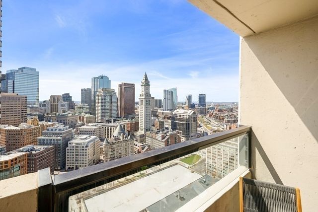 a kitchen with a stove and white cabinets