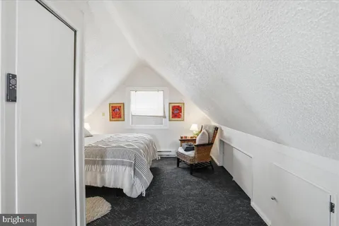 a room with a bed and a window