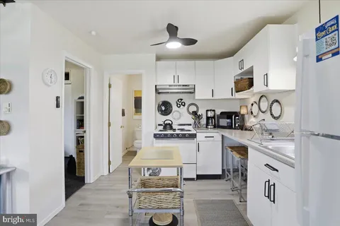 a kitchen with a sink cabinets and appliances