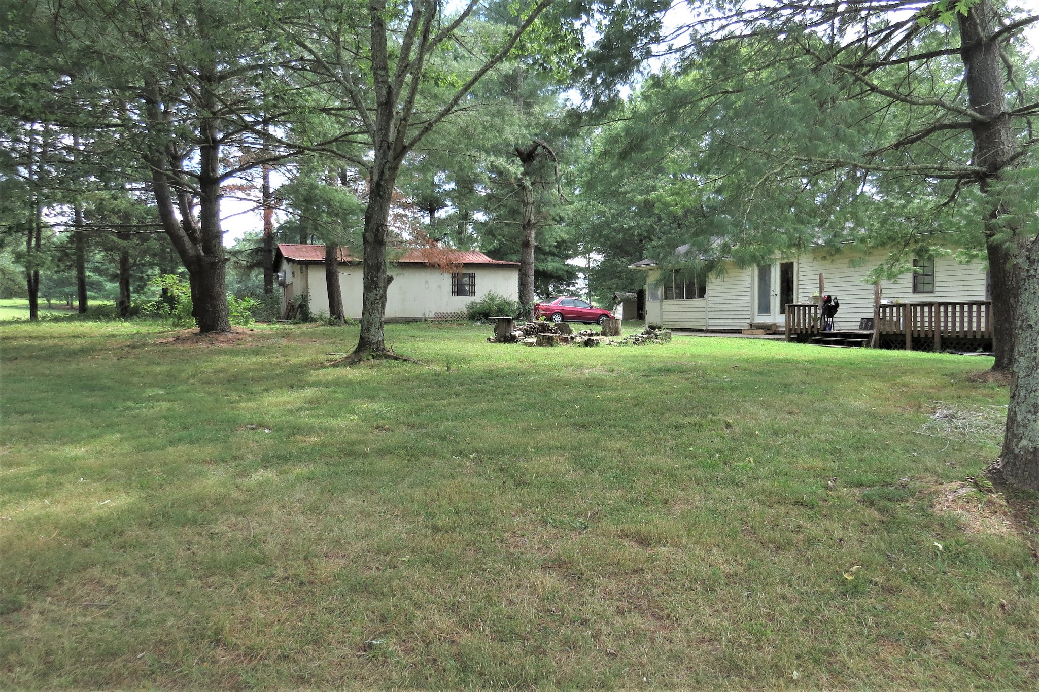 2749 North Mt Pleasant Road Greenbrier, TN 37073 - Photo 11 of 13 a view of a house with a yard and large trees