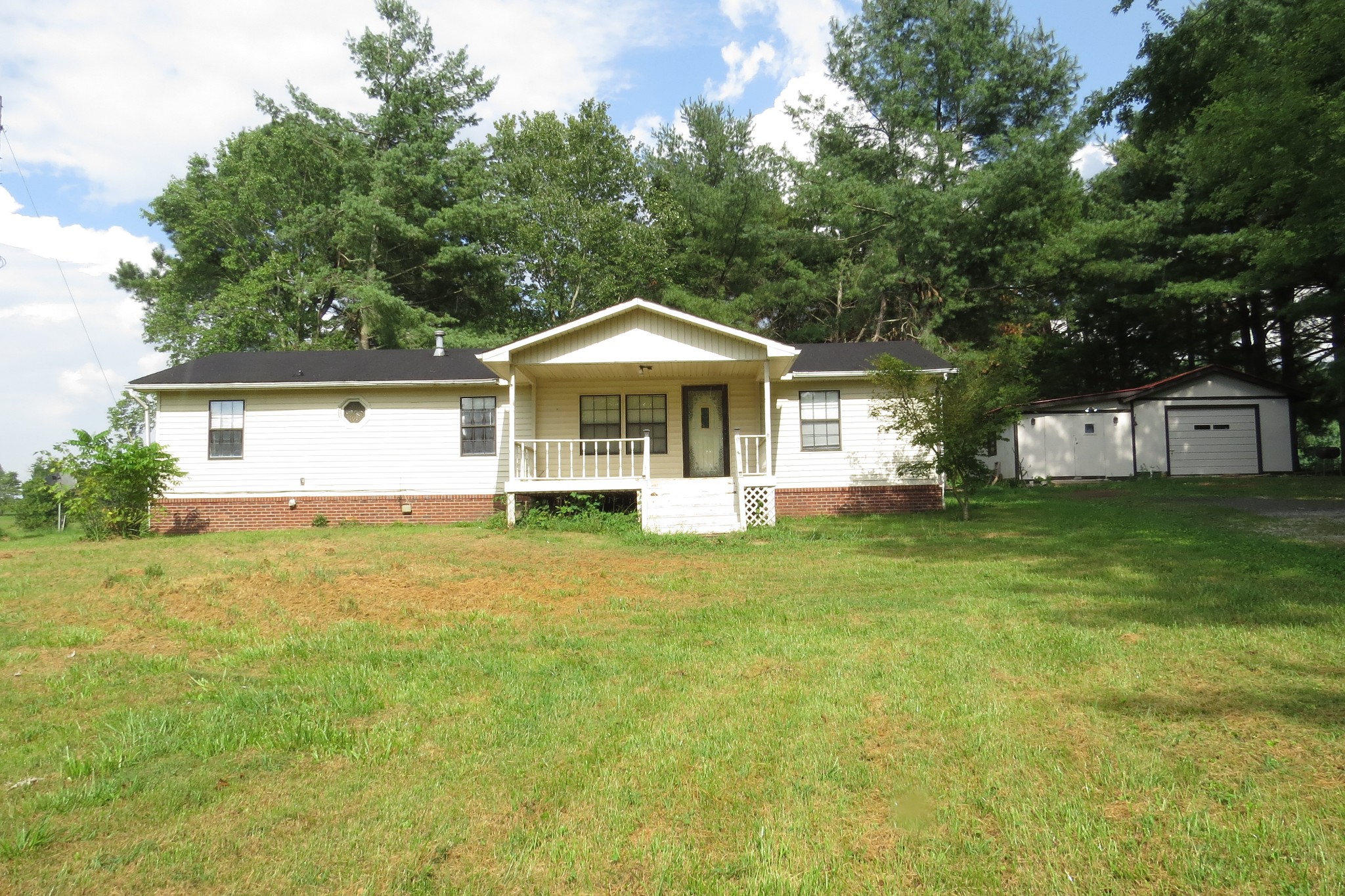 2749 North Mt Pleasant Road Greenbrier, TN 37073 - Photo 12 of 13 a front view of a house with garden