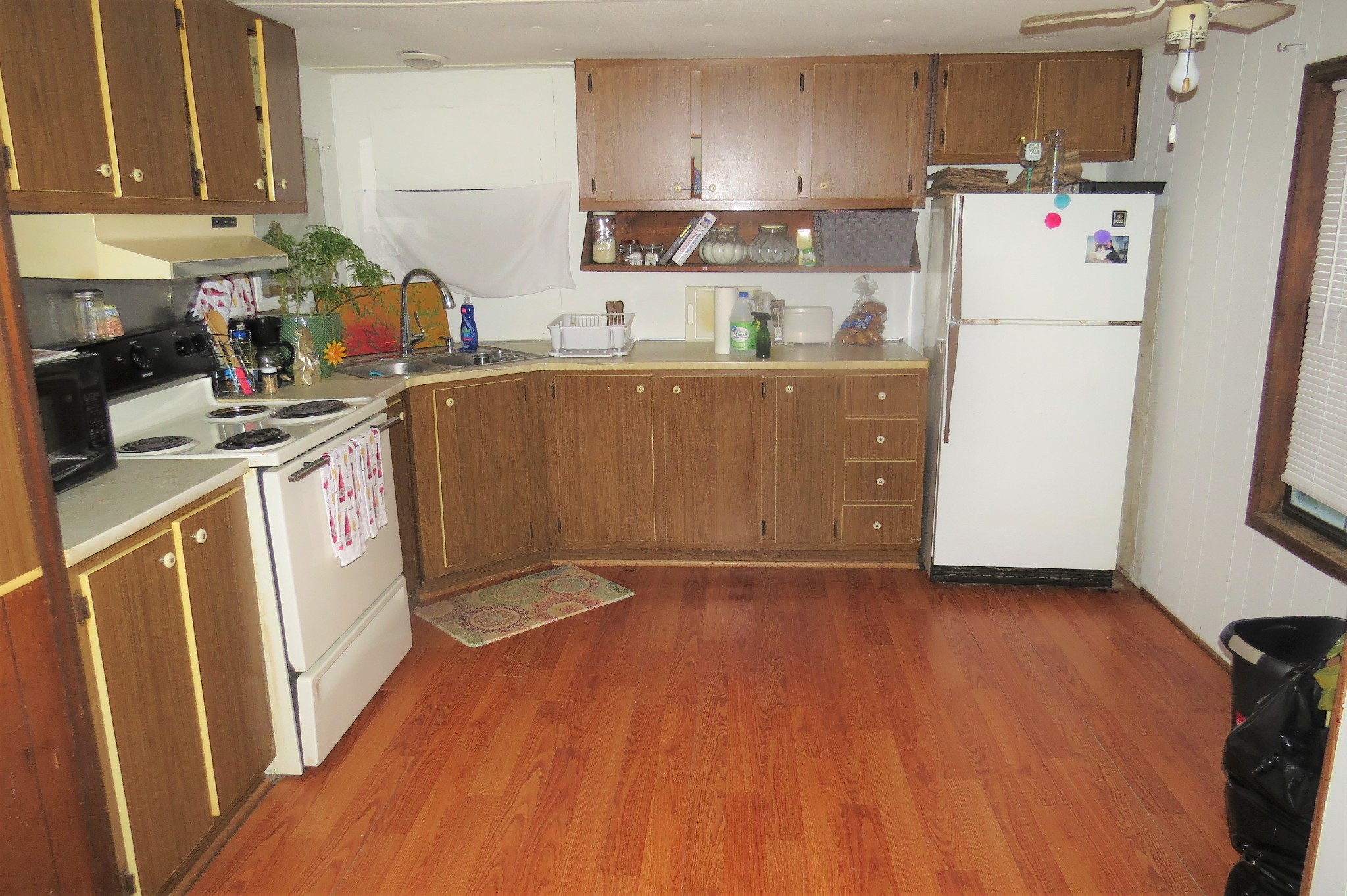 2749 North Mt Pleasant Road Greenbrier, TN 37073 - Photo 3 of 13 a kitchen with a refrigerator a stove and wooden floor