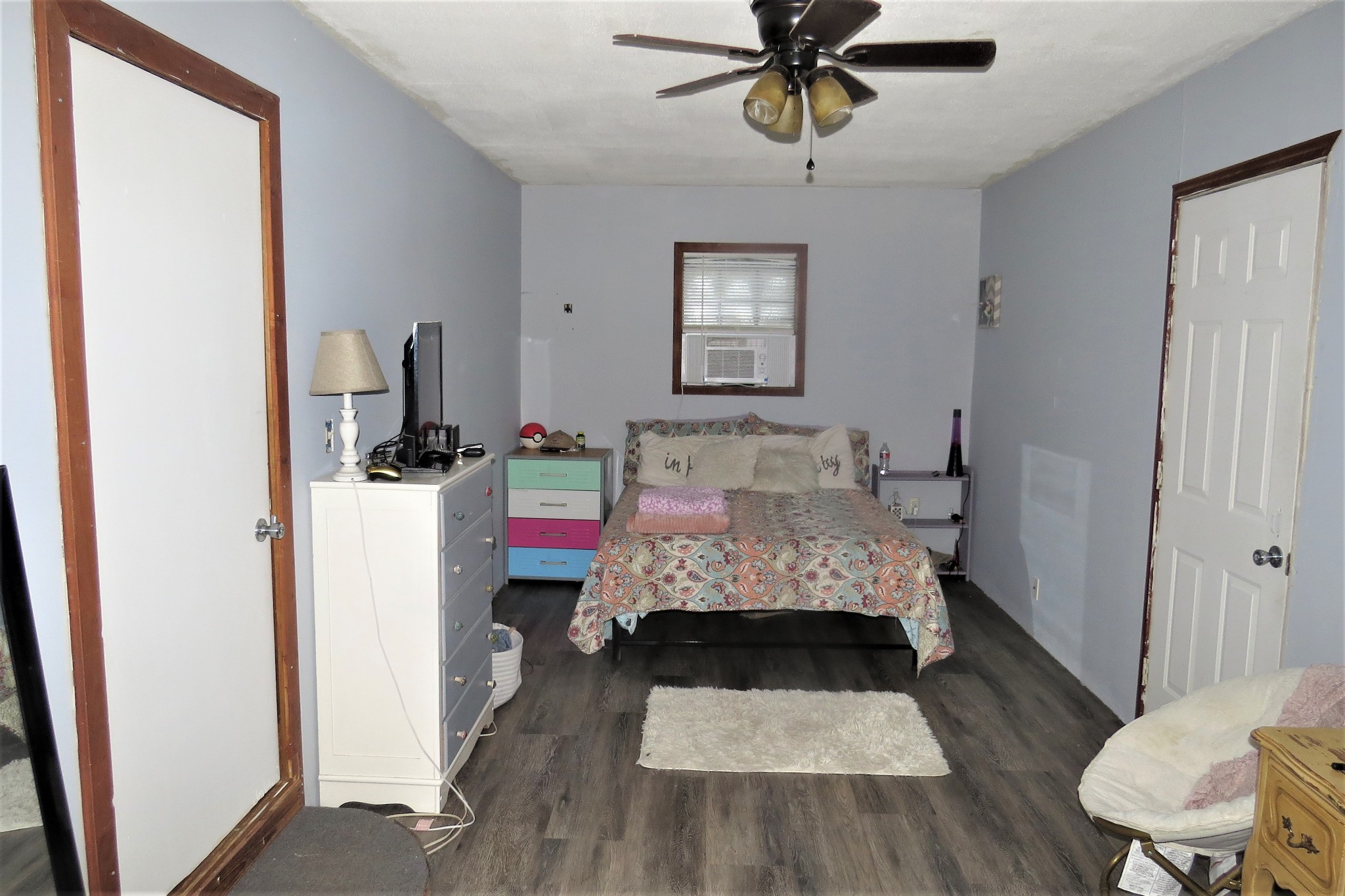 2749 North Mt Pleasant Road Greenbrier, TN 37073 - Photo 6 of 13 a room with a couch and a dining table with wooden floor