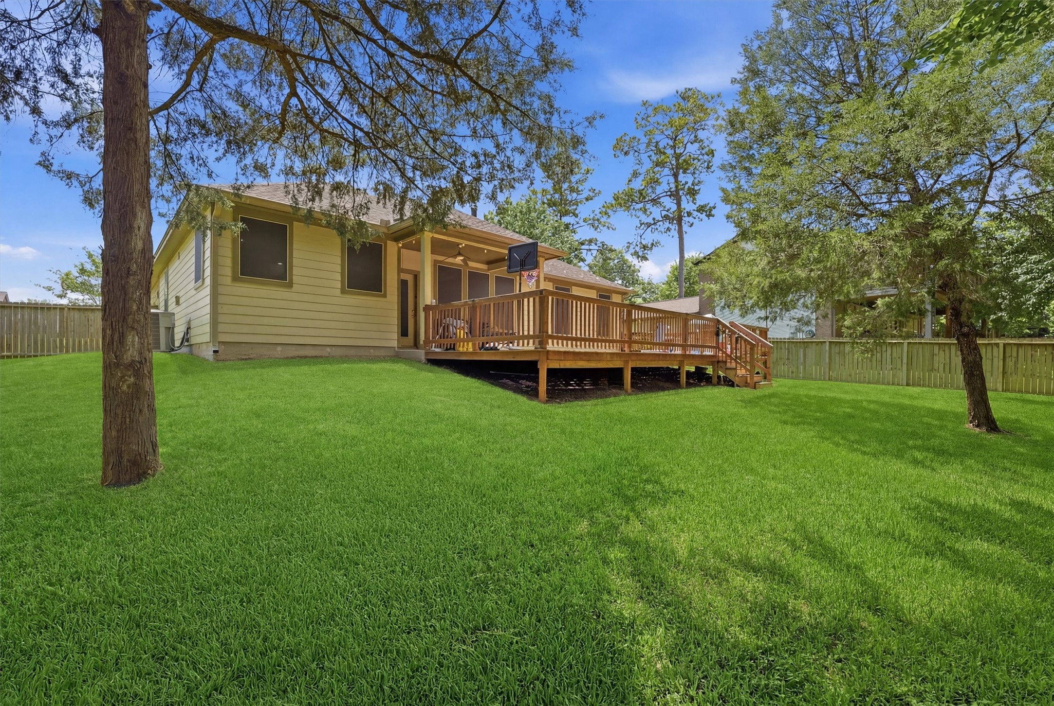 205 Kingspoint Conroe, TX 77356 - Photo 24 of 29 Fenced backyard with patio