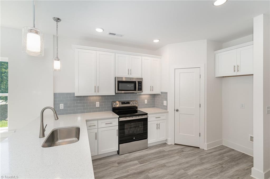 3600 Bridleton Ridge Trail Greensboro, NC 27410 - Photo 1 of 31 Stylish quartz countertops in kitchen