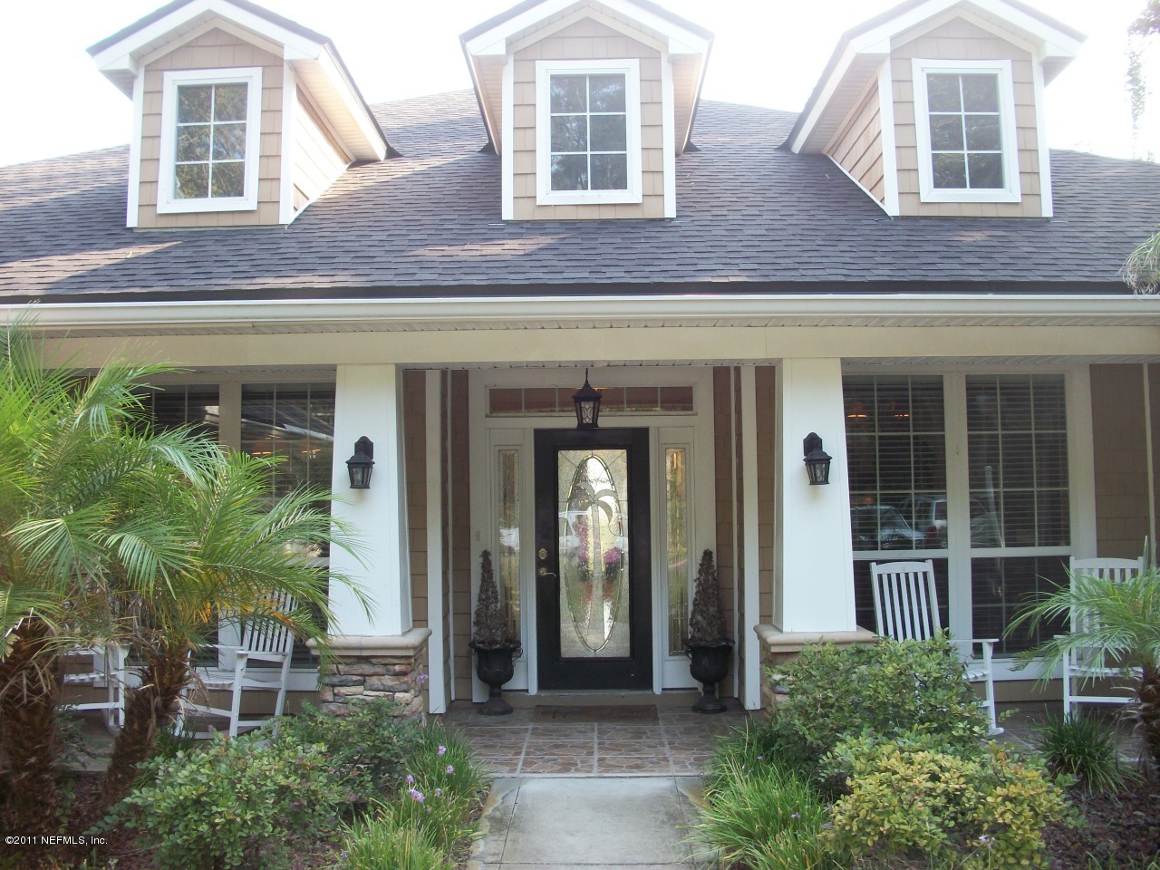 97274 Pirates Point Road Yulee, FL 32097 - Photo 2 of 20 front view of a brick house with a large window