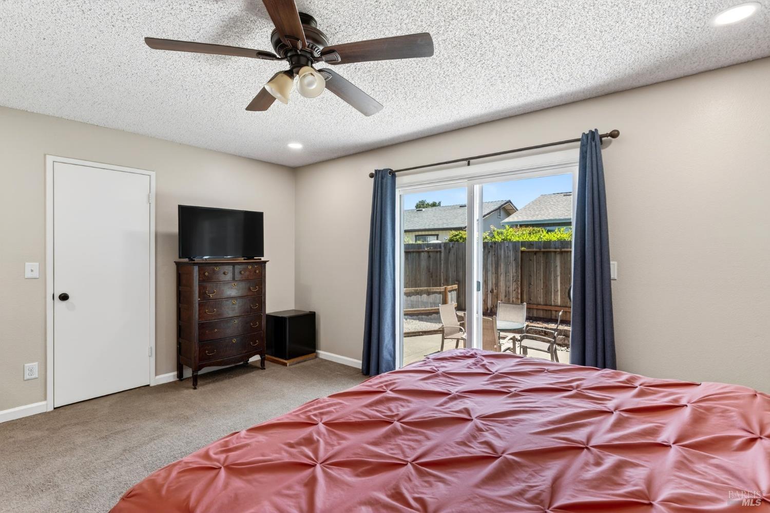 4526 Hillview Court Rohnert Park, CA 94928 - Photo 13 of 28 a bedroom with a bed and a television