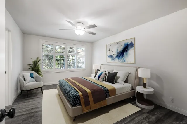 a bedroom with a large bed and a couch