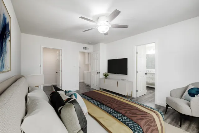 a living room with furniture and a flat screen tv