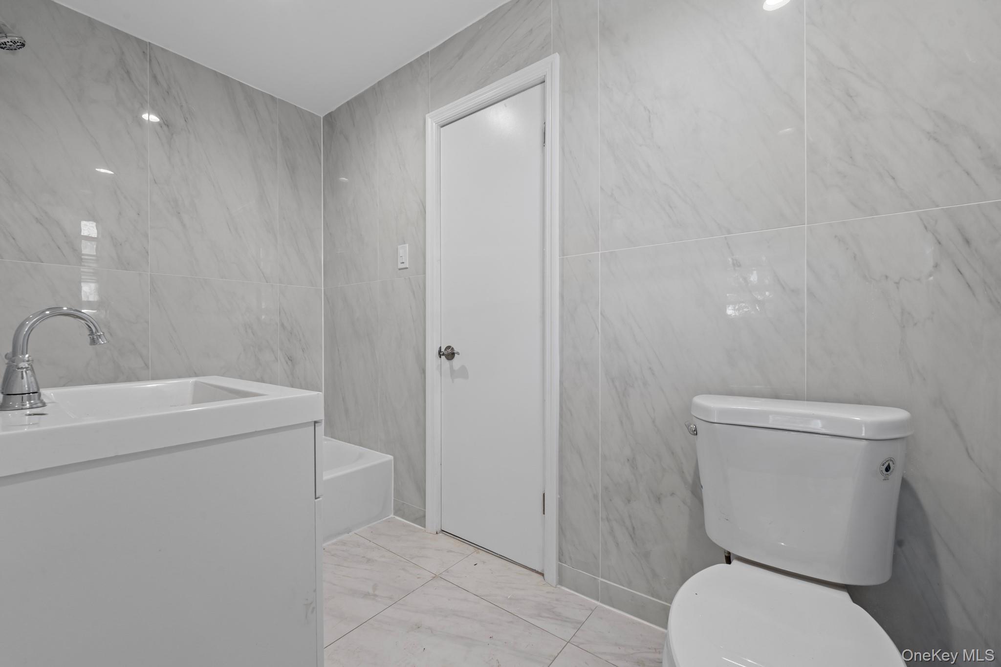 172-11 Horace Harding Expressway Queens, NY 11365 - Photo 14 of 17 a bathroom with a toilet sink and shower