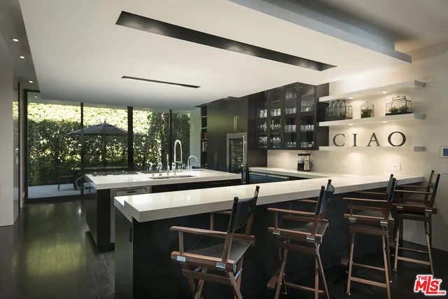 a bed room with a bed and a large window