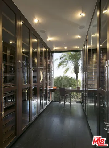 a kitchen with a sink cabinets and wooden floor