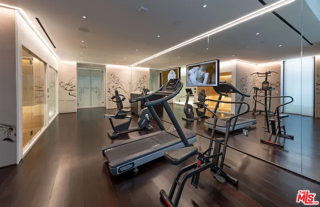 a room with lots of gym equipment