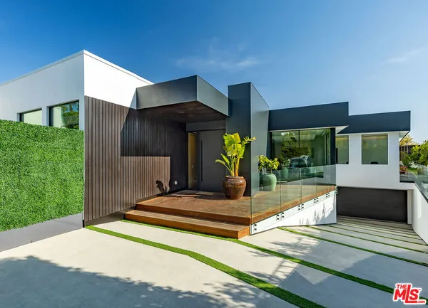 a living room with furniture and flowers