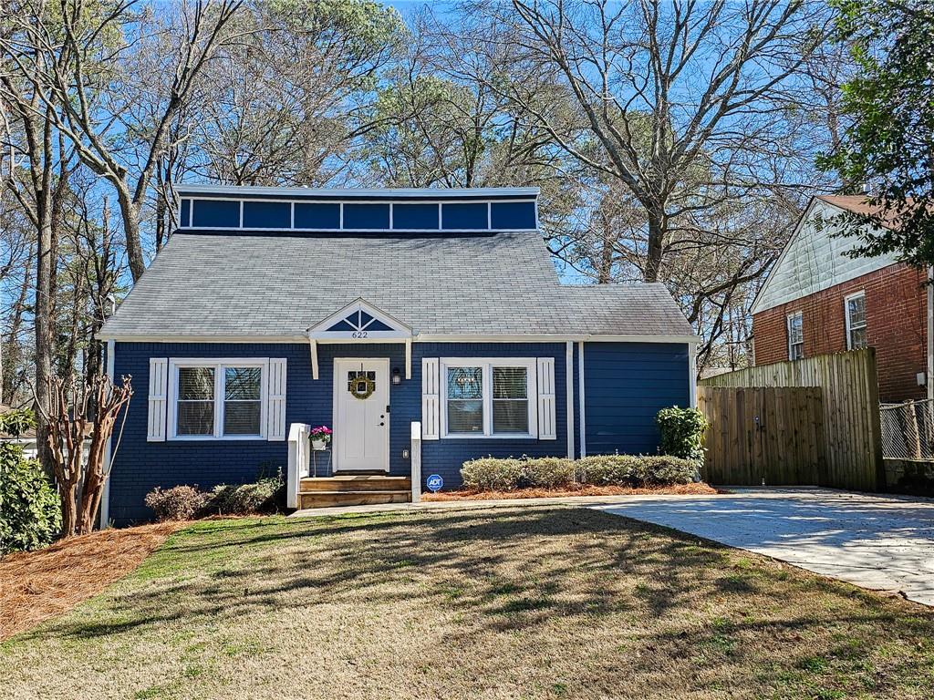 622 Daniel Avenue Decatur, GA 30032 - Photo 1 of 1 a front view of a house with a yard and garage