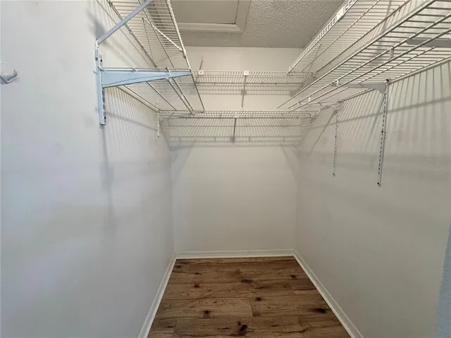 a bathroom with a sink a toilet a mirror and a shower