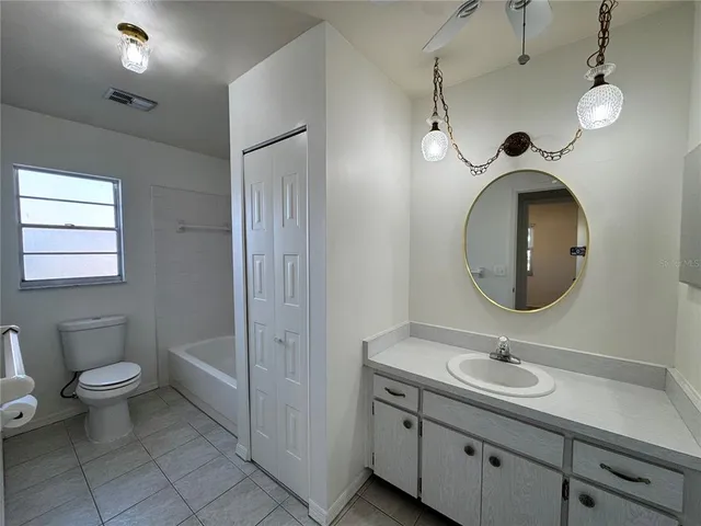 a utility room with cabinets washer and dryer
