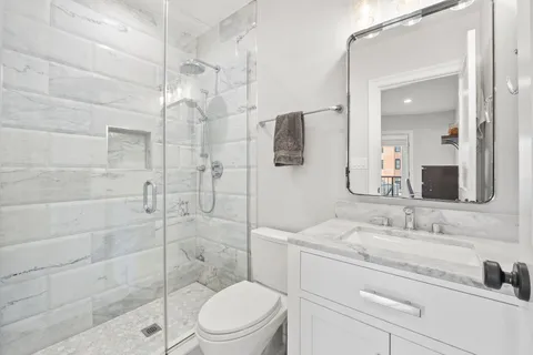 a kitchen with a sink appliances and cabinets