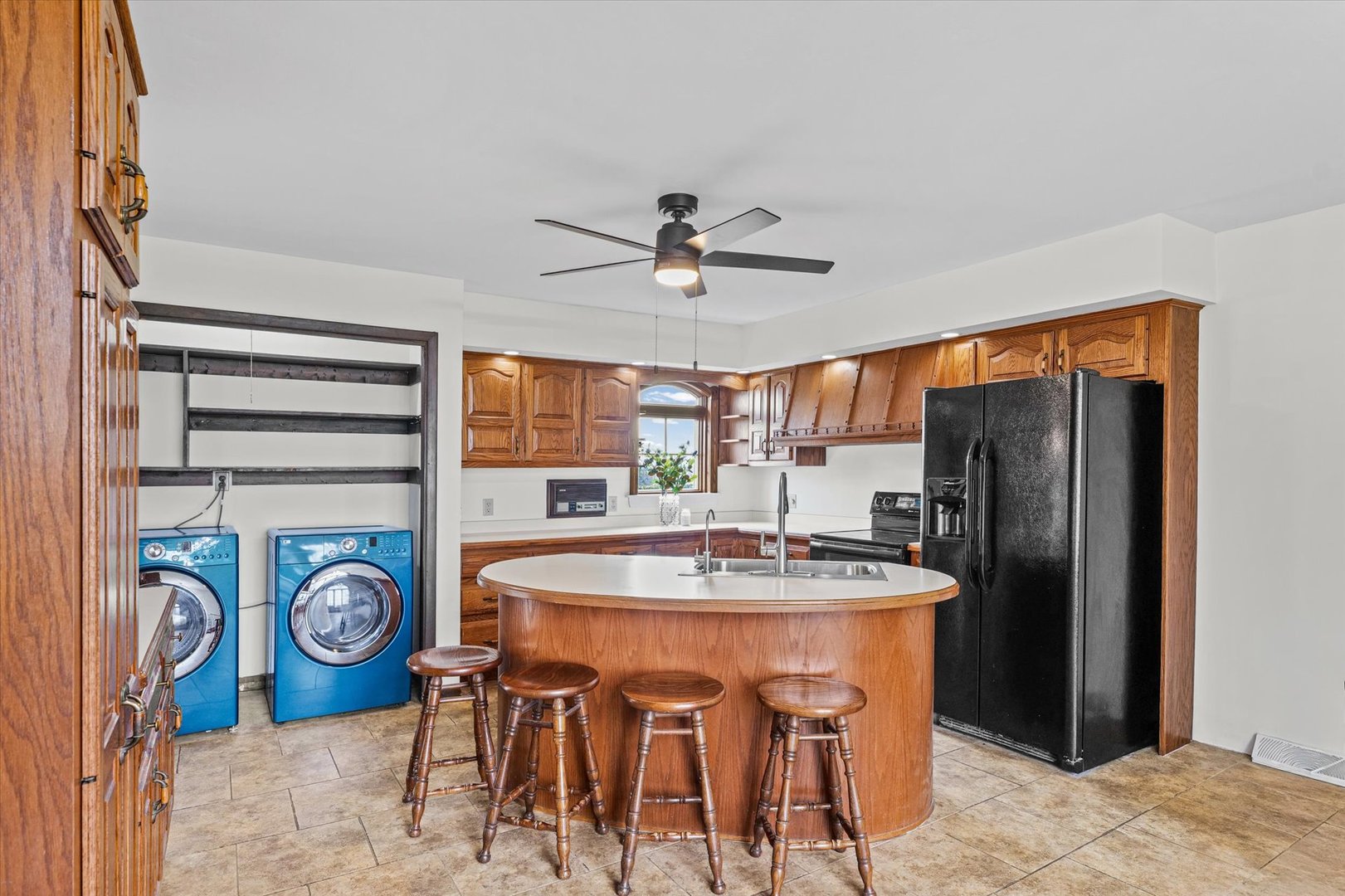 7961 North 3000 E Road Forrest, IL 61741 - Photo 17 of 66 a dining room with stainless steel appliances granite countertop furniture and a clock