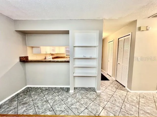 a view of a kitchen with a dishwasher and a refrigerator