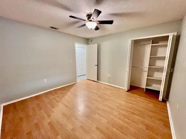 a view of a house with backyard sitting area and garden