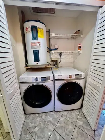an aerial view of residential house with outdoor space and lake view