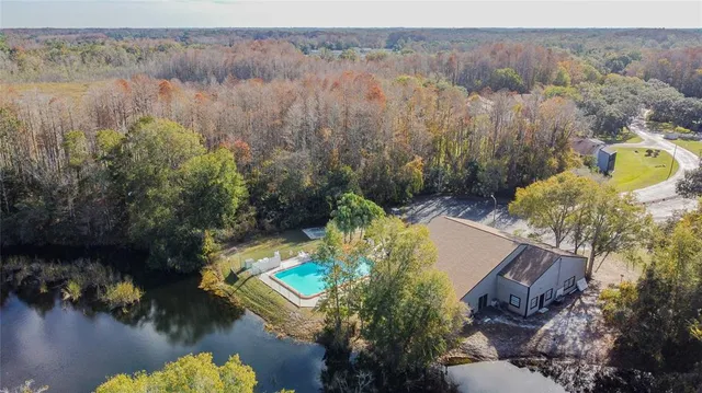 a view of a swimming pool with a lake view