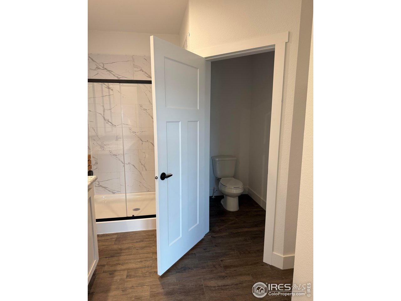 45881 County Road 35 Pierce, CO 80650 - Photo 13 of 47 a bathroom with a toilet and a shower