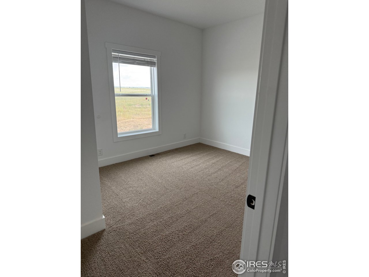 45881 County Road 35 Pierce, CO 80650 - Photo 22 of 47 a view of an empty room with a window