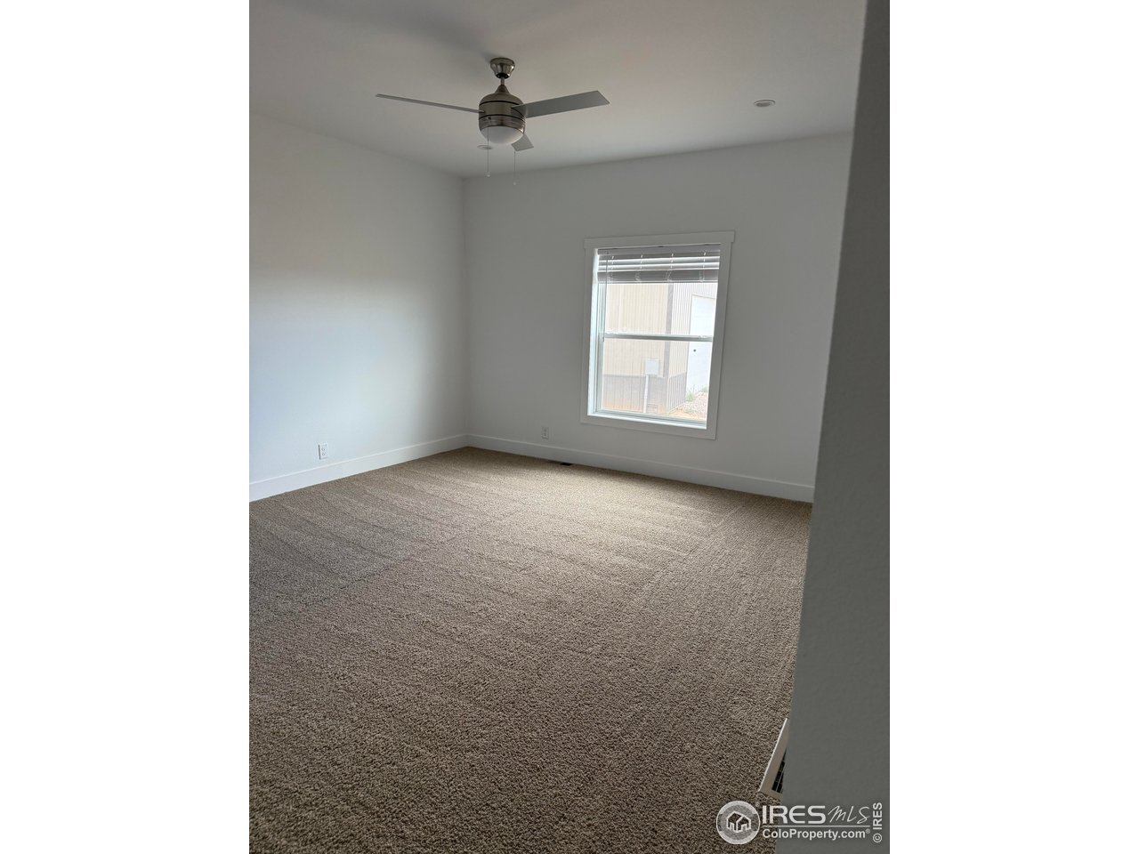 45881 County Road 35 Pierce, CO 80650 - Photo 24 of 47 a view of room with a ceiling fan and window