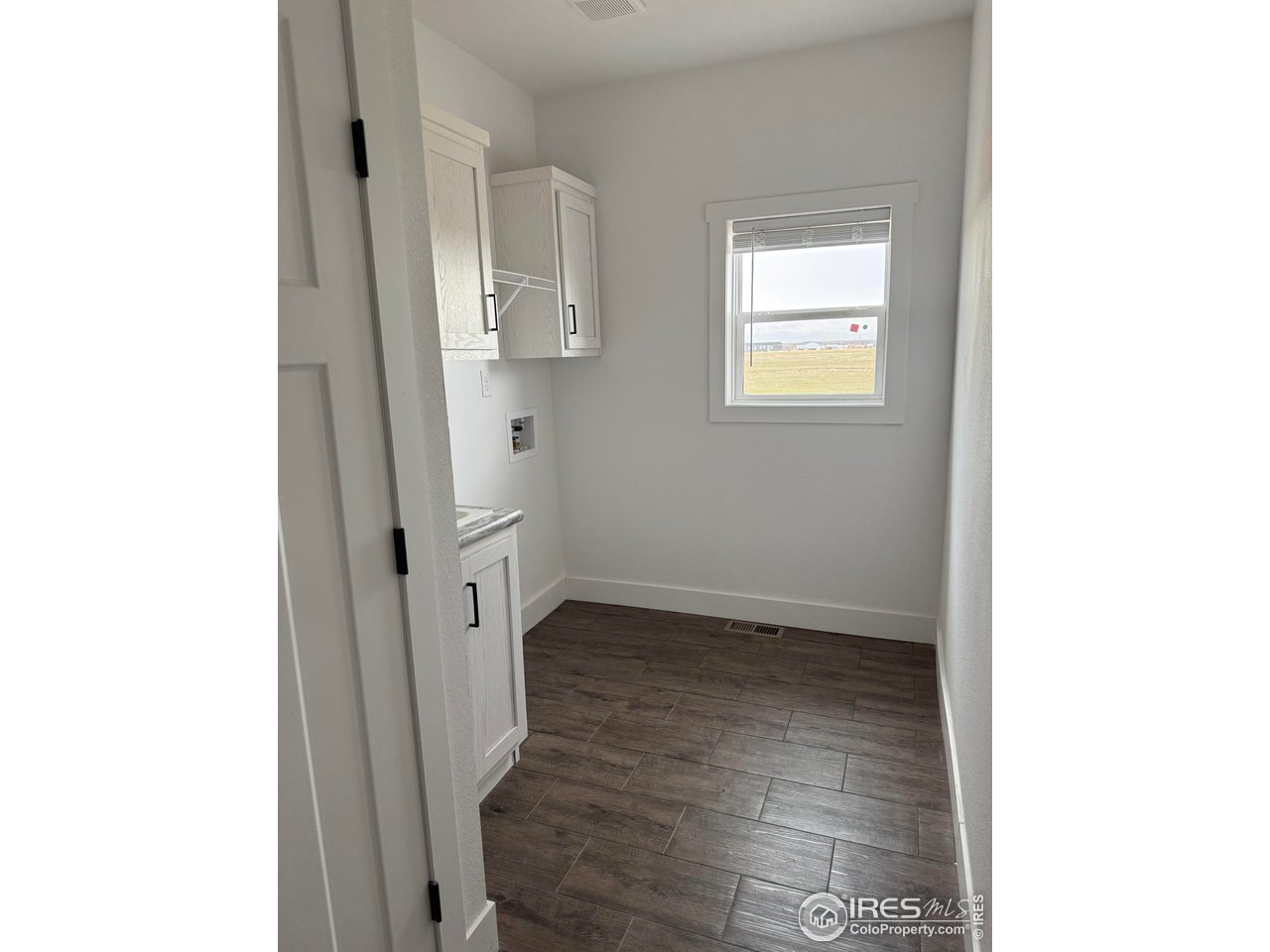 45881 County Road 35 Pierce, CO 80650 - Photo 26 of 47 a view of an entryway with wooden floor