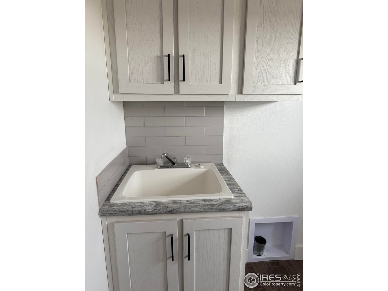 45881 County Road 35 Pierce, CO 80650 - Photo 27 of 47 a bathroom with a sink and cabinets