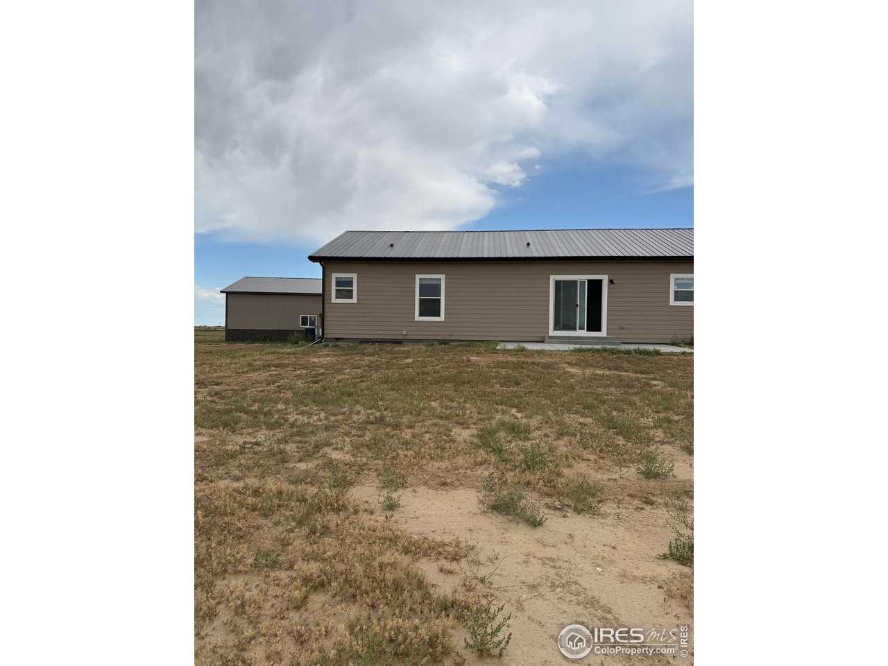 45881 County Road 35 Pierce, CO 80650 - Photo 42 of 47 a view of a house with a yard