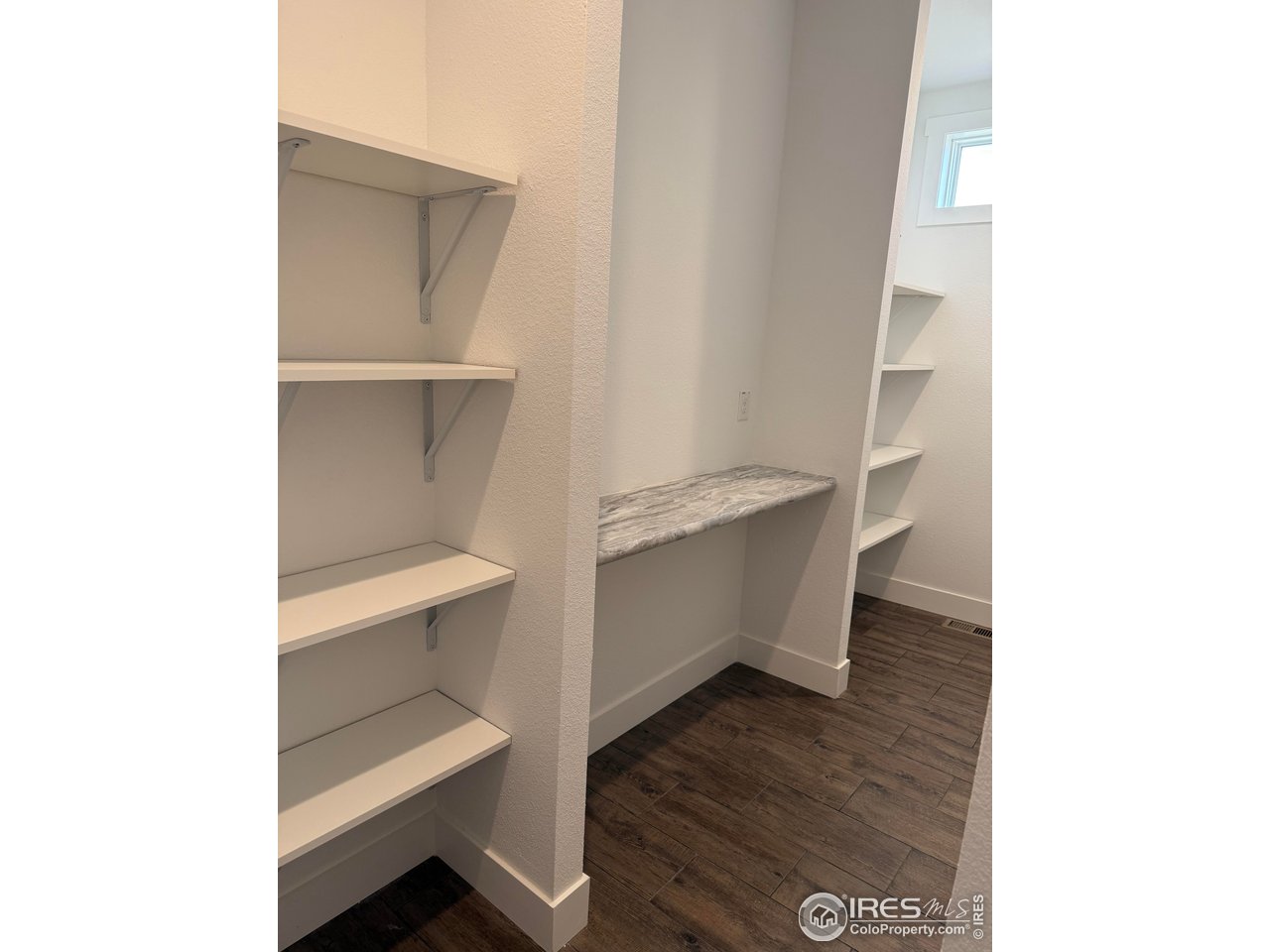 45881 County Road 35 Pierce, CO 80650 - Photo 5 of 47 a view of an empty room with cabinet and stairs