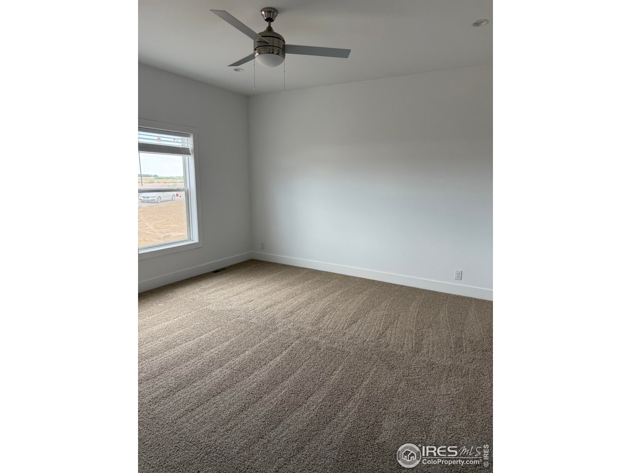 45881 County Road 35 Pierce, CO 80650 - Photo 10 of 47 a view of an empty room with a window