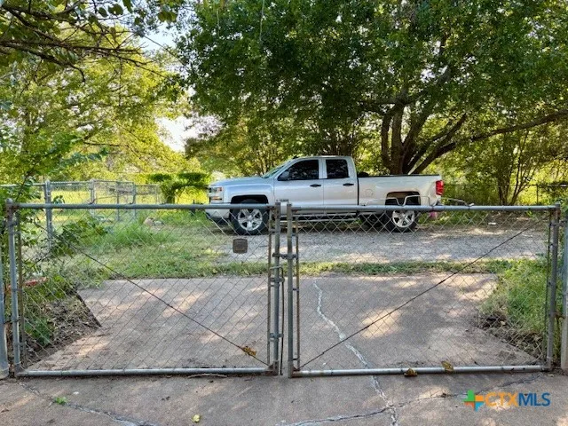 a view of a back yard of the house