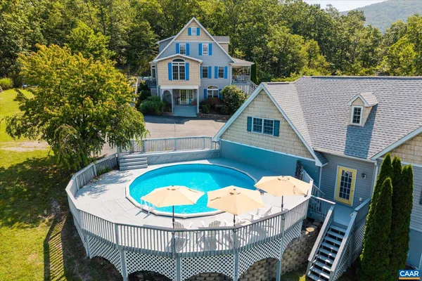 a view of swimming pool with sitting area
