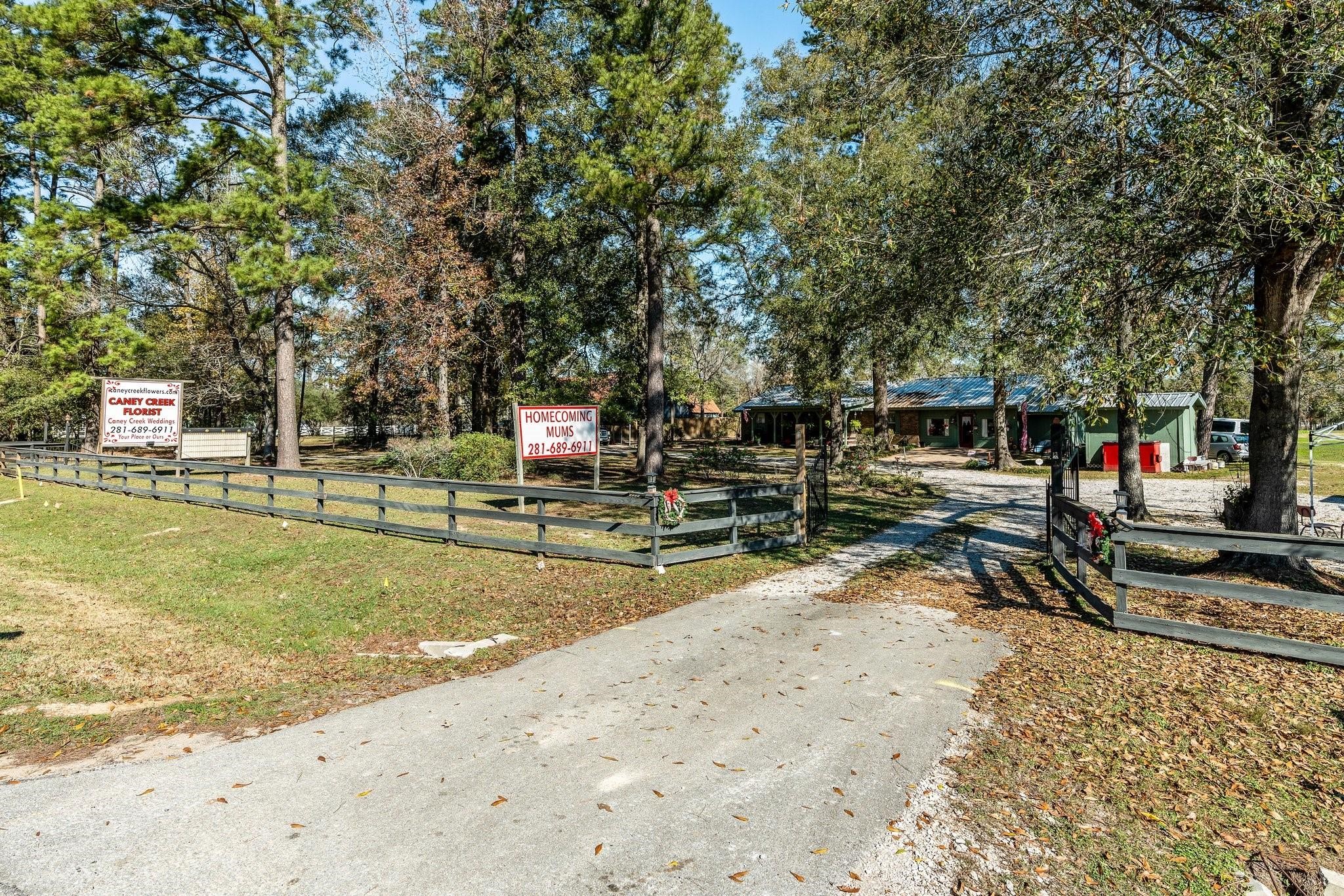 15091 Farm To Market 1485 Conroe, TX 77306 - Photo 19 of 28 a view of a park with swings and slides