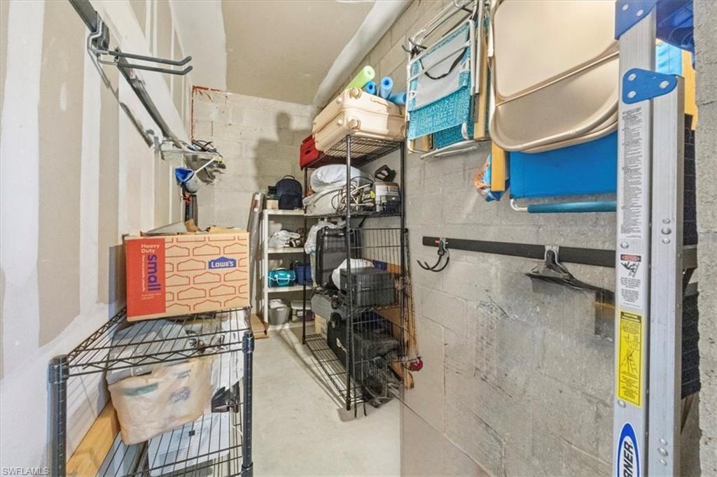 9566 Trevi Court, Unit 4942 Naples, FL 34113 - Photo 21 of 31 a utility room with dryer and washer