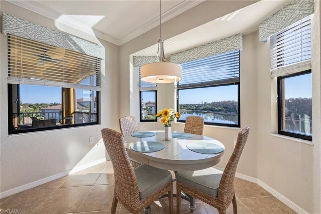 9566 Trevi Court, Unit 4942 Naples, FL 34113 - Photo 9 of 31 a dining room with furniture and window