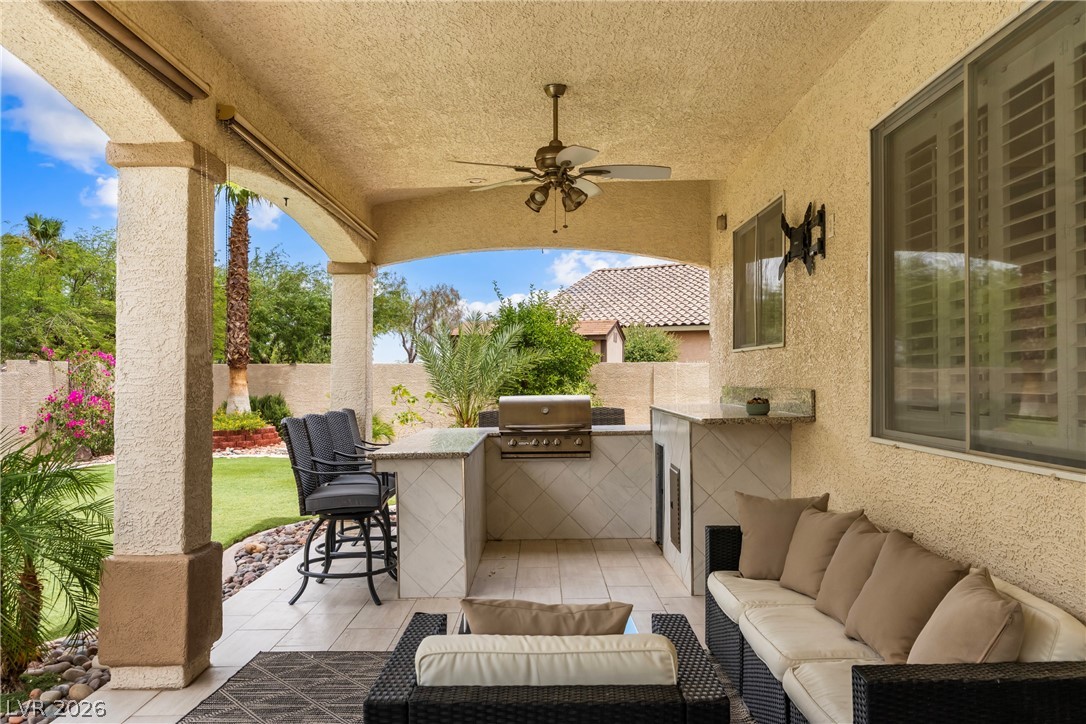 708 Vortex Avenue Henderson, NV 89002 - Photo 47 of 71 An inviting outdoor living space features an integrated barbecue and ample seating for relaxed entertaining.