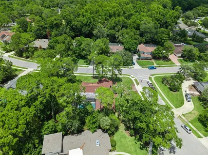 an aerial view of a house with a yard