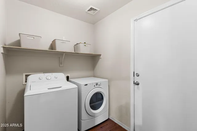 a utility room with dryer and washer