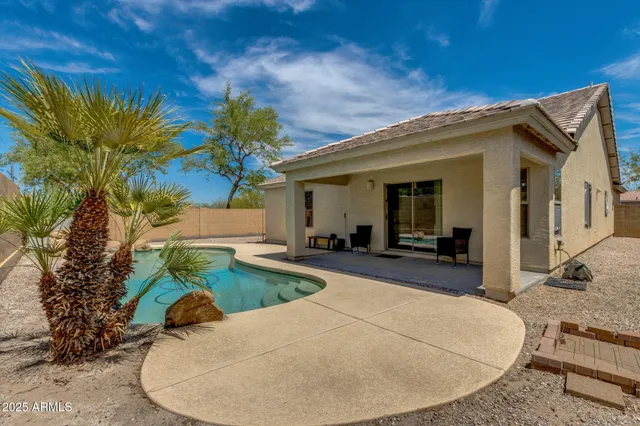 a view of a backyard of the house