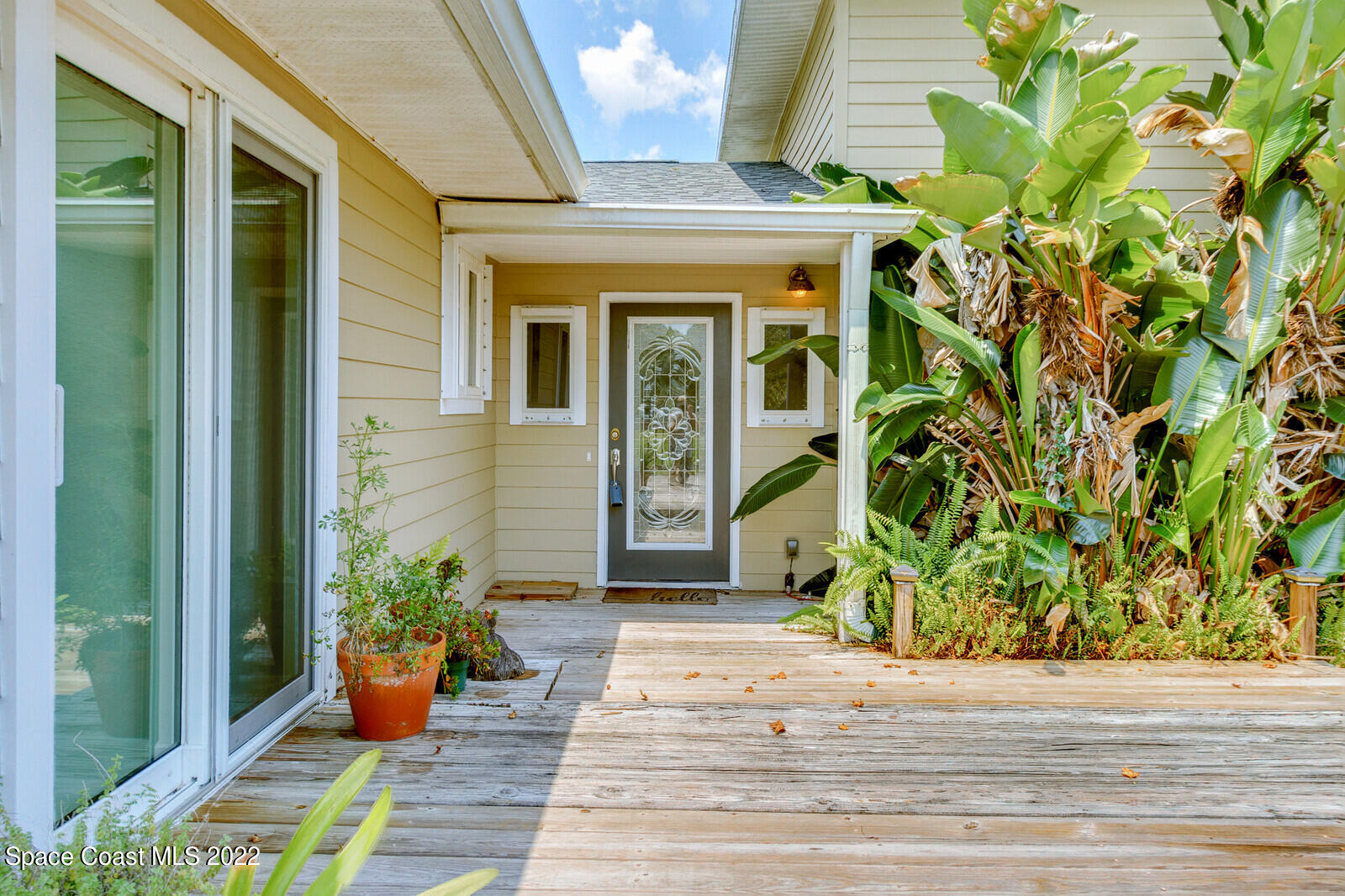 3600 Grant Line Road Mims, FL 32754 - Photo 8 of 54 a front view of a house with garden