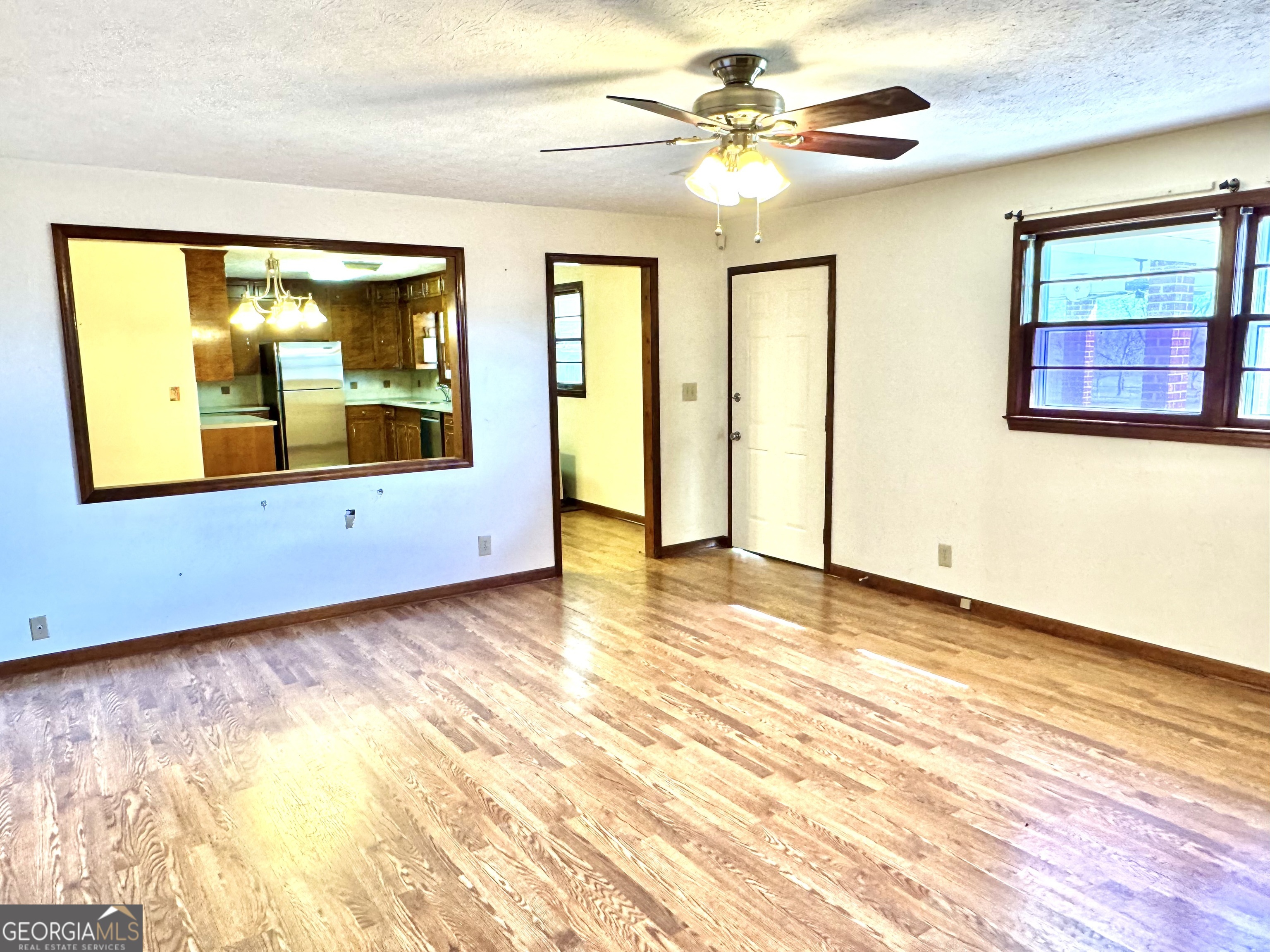 1760 Fears Road Rutledge, GA 30663 - Photo 10 of 68 a view of an empty room with a window and a ceiling fan