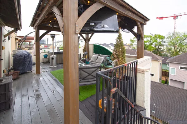 a view of a deck with couches and wooden floor