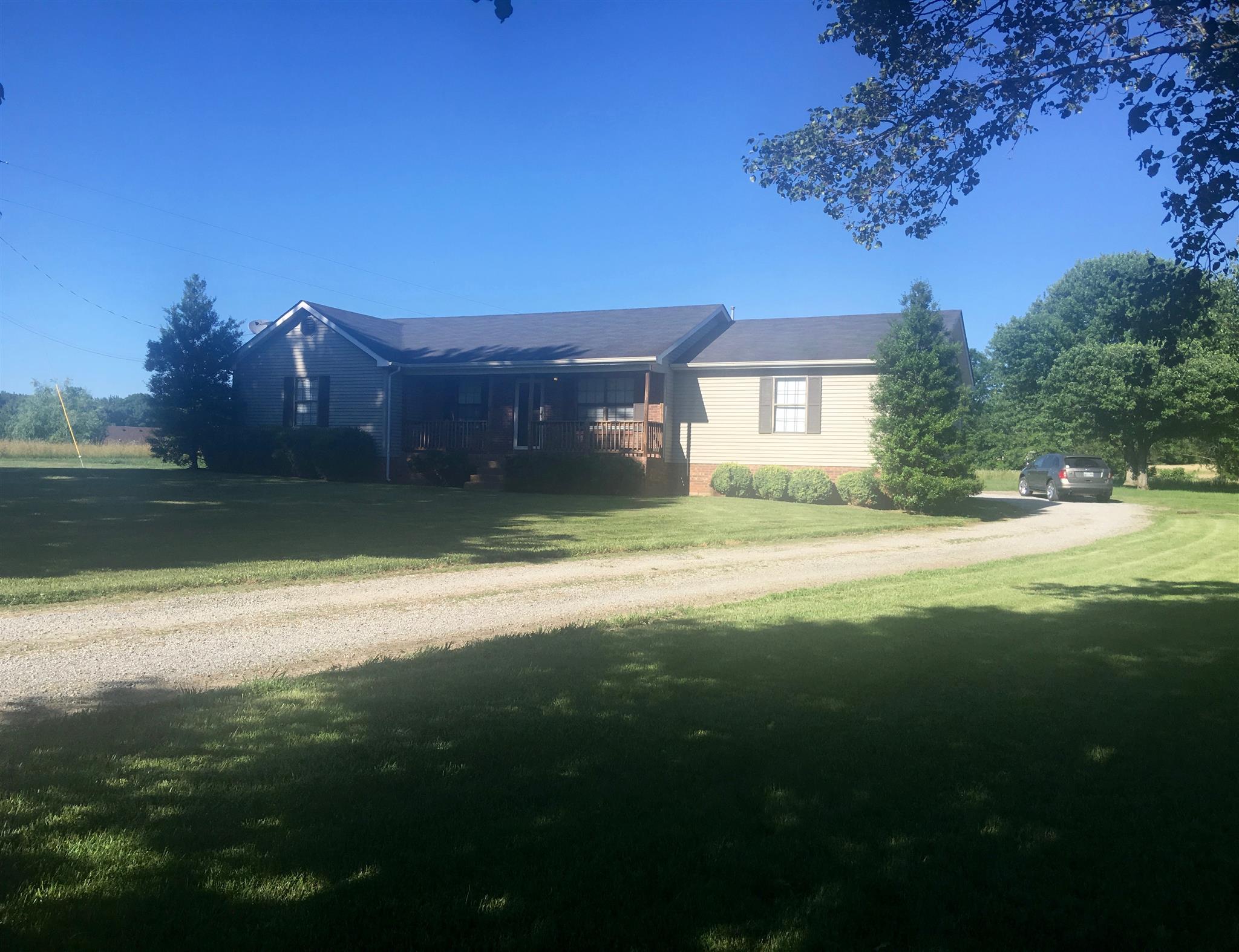 197 T G T Road Portland, TN 37148 - Photo 4 of 6 a view of a house with a yard